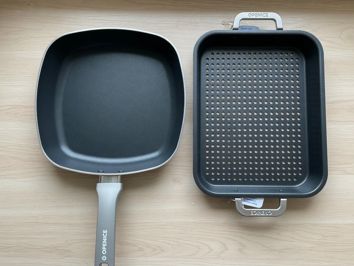 OPENICE two-piece nonstick set — a larger pan and a medium crisper tray — arranged side by side on a light wood kitchen